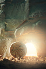 Stone is rolled away from empty grave on Easter morning. Jesus Christ resurrection. Empty tomb of...