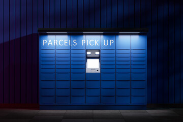 Blue automatic mail terminal device for self receiving packages. A parcel terminal for receiving an order is standing on the street at night. Front view. 3d rendering