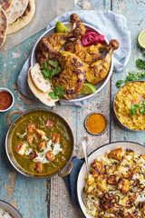 Indian cuisine dinner: tandoori chicken, biryani