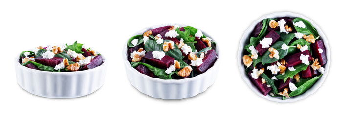 Spinach beet goat cheese walnuts salad on a white isolated background