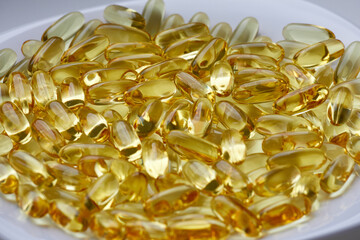 Fish oil in capsules on a white background. Omega 3.