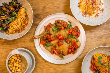 italian food, pasta, tomatoes, pizza, collage on the table