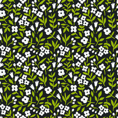 Simple cute pattern in small white flowers on dark green background. Liberty style. Ditsy print. Floral seamless background. The elegant the template for fashion prints.