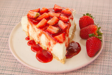 delicious cheesecake with strawberries on  plate