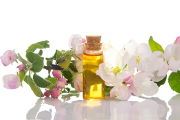 Essence of flowers on table in beautiful glass jar