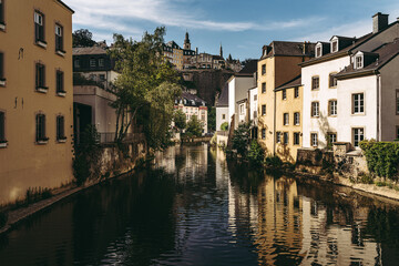 Fototapeta na wymiar Alzette river crossing the historical old town of Luxembourg, called Grund