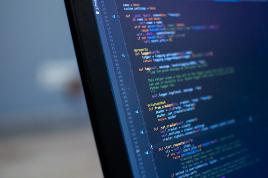Programmer coding python, java script, html code on notebook screen at home. Work from home. Working process illustration for business.