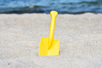 Shovel toy on the sand