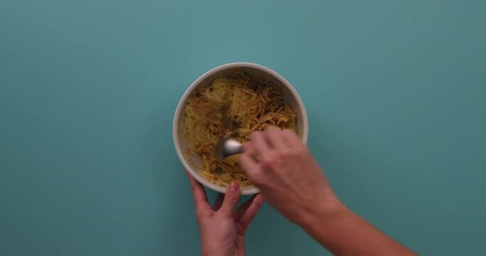 cooking and taking a bite out of the hash browns
