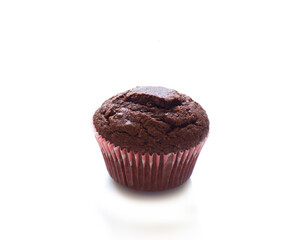 Chocolate miffin in a paper tin isolated on a white