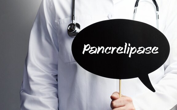 Pancrelipase. Doctor with stethoscope holds speech bubble in hand. Text is on the sign. Healthcare, medicine