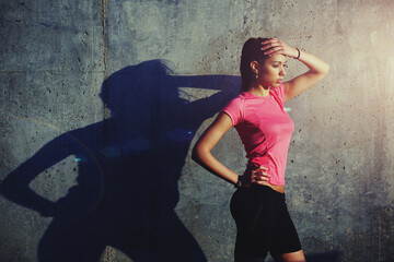 Sportswoman doing an active fitness training on concrete 