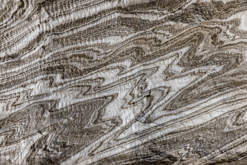 Abstract gray texture of natural, raw salt in an underground salt mine