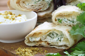 Lavash roll stuffed with cheese and herbs