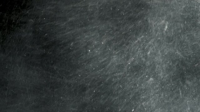 4K Dust and hay explosion cloud swirling and descending in slow-motion  
