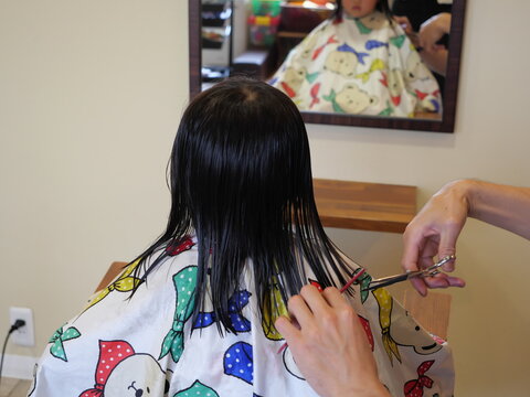 Where a child gets their hair cut at a beauty salon