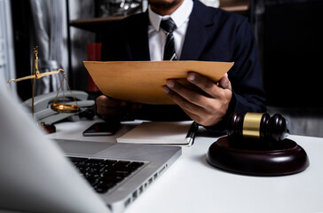 Midsection Of Lawyer working at the office desk. Justice and law concept. 