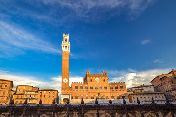 The Torre del Mangia, tower in the Piazza del Campo in Siena town in the Tuscany region of Italy, Europe.