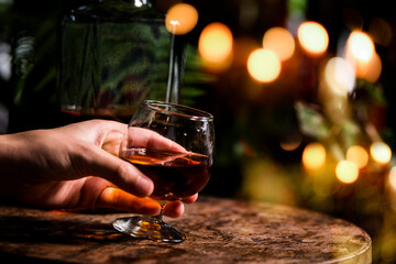 Blurred image a glass of whiskey. 