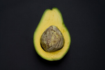 Chopped avocado on a black background
