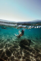 Fototapeta na wymiar girl swimming underwater