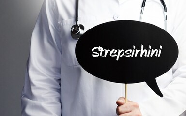 Strepsirhini. Doctor with stethoscope holds speech bubble in hand. Text is on the sign. Healthcare, medicine