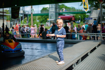 Girl enjoying activity in the adventure park on a summer day. Childhood, lifestyle. 