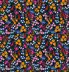Cute floral pattern in the small flower. Ditsy print. Motifs scattered random. Seamless vector texture. Elegant template for fashion prints. Printing with small colorful flowers. Dark blue background.