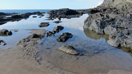 where the land meets the sea and forms paradise