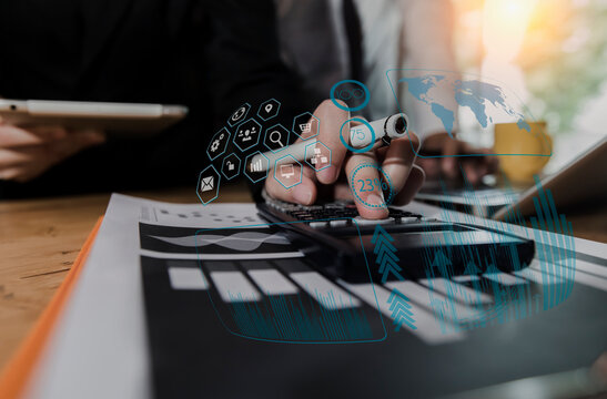 Concept of digital diagram, graph interfaces icons, virtual screen, connections icon on blurred background. business people hands working with startup project  network online. - Powered by Adobe