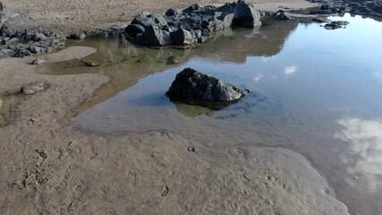 where the land meets the sea and forms paradise