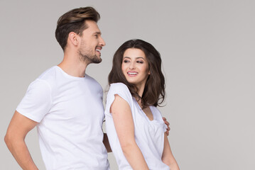 Happy summer cute couple wearing blue jeans