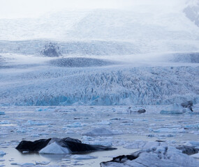 The beautiful Fjallsarjokull glacier and icebergs of the Fjallsarlon lagoon in the Vatnajokull National Park, Southeast Iceland.