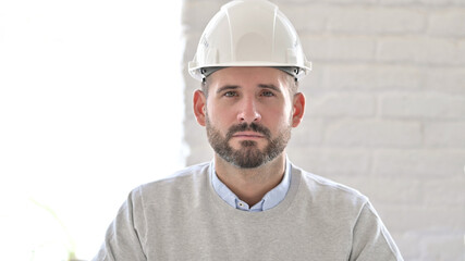 Portrait of Serious Young Engineer Looking at the Camera