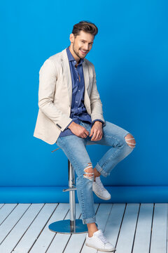 Happy Handsome Young Man Over Blue Background