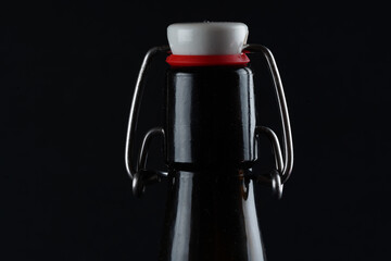 beer bottle with lid dark glass on a dark background