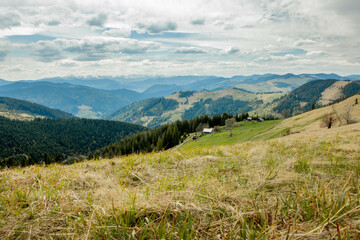 Carpathian Mountains top view landscape ridge summer season dramatic weather time with cloudy blue sky background