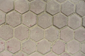 Top view of the hexagonal gray street tile background texture.
