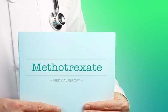 Methotrexate. Doctor (male) with stethoscope holds medical report in his hands. Cutout. Green turquoise background. Text is on the documents. Healthcare/Medicine