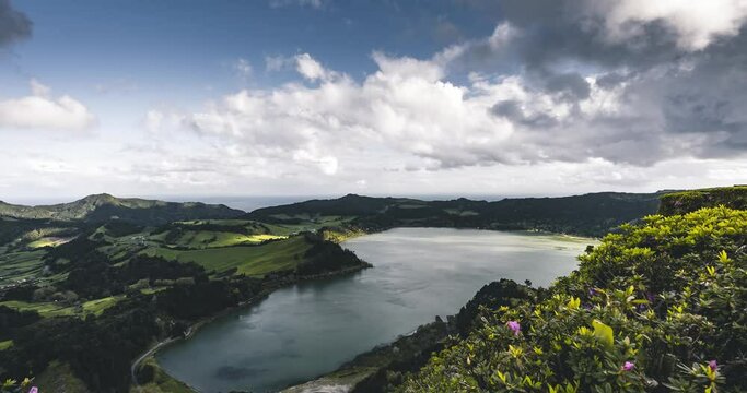 Timelapse Aerial drone view of Furnas lake, Lagoa das Furnas 4k moving Time lapse Video clip of Sao Miguel island, Azores, Acores, Portugal. Beautiful summe day with fast moving clouds.