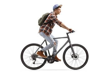 Profile shot of a male student riding a bicycle