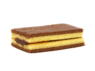 Sponge cake bar with cocoa cream filling isolated on white
