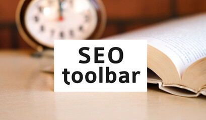 Seo toolbar business concept text on a white book and clock