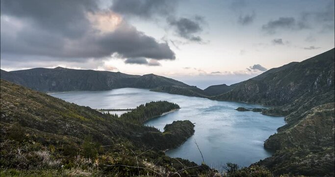 Timelapse Lagoa do Fogo Fire Lake 4k moving time lapse Video clip from sunset on Sao Miguel Island, Azores, Acores, Portugal. Pink sky during twilight with clouds in windy conditions.