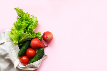 Zero waste shopping concept - vegetables and fruits in textile bag, top view