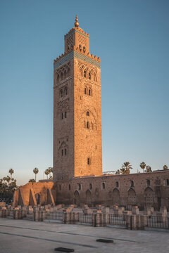 Koutoubia Mosque minaret during twilight located at medina quarter of Marrakesh, Morocco, North Africa. Sunset view on a sunny day with blue sky.