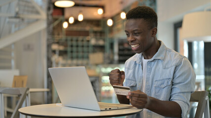 Successful Online Shopping by Happy Young African Man