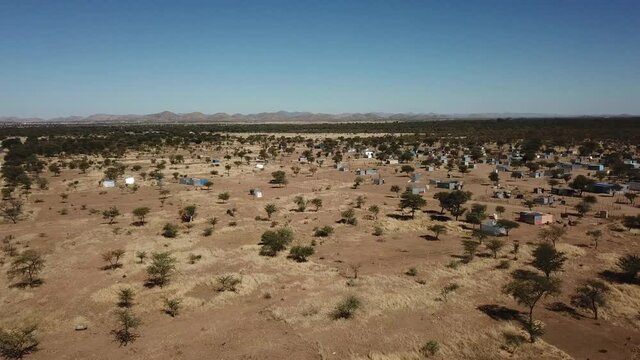 4K aerial drone video of Karibib, a small town in Erongo Mountains at B1 highway to west coast of Namibia and its township on hot sunny day in Erongo Region, central Namibia
