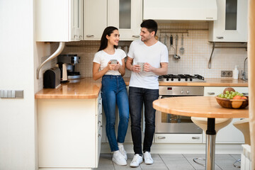 Lovely family enjoying coffee together at their home