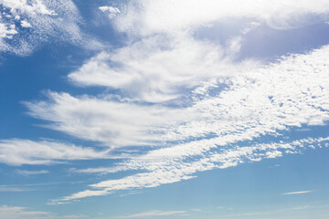 Swirl of white clouds in a blue sky 